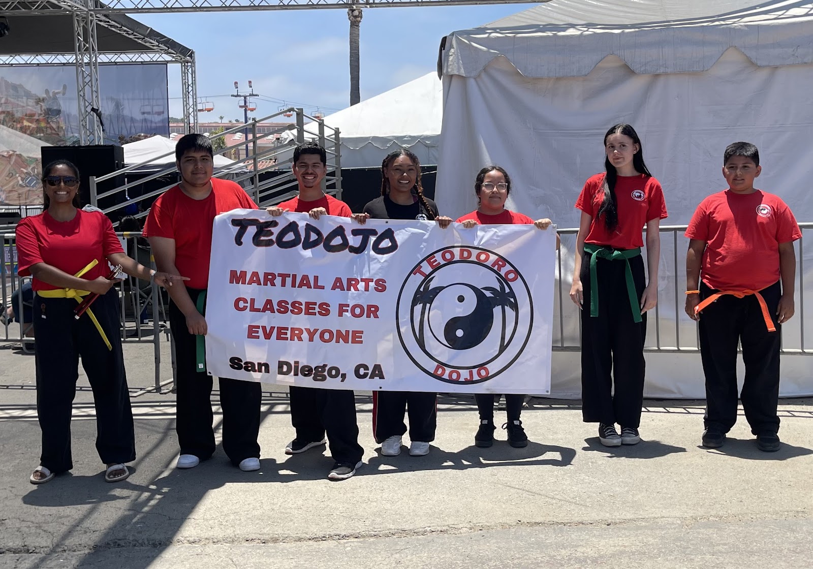 The Teodojo team with their martial arts banner in San Diego